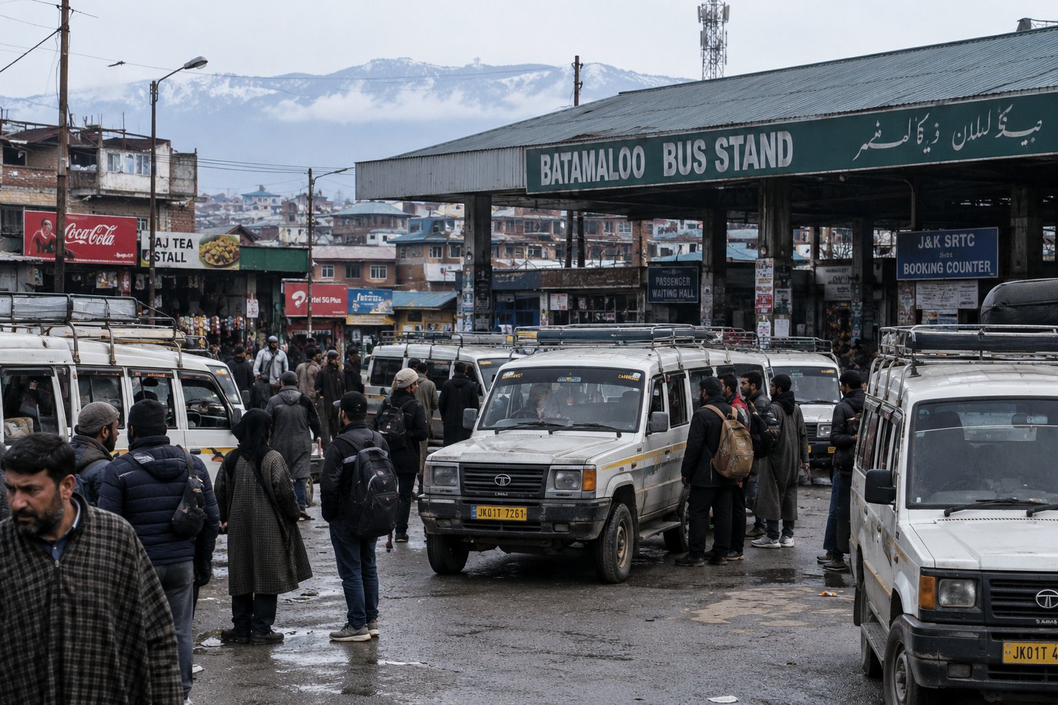 Crowded Batamaloo Bus Stand in Srinagar with Tata Sumo taxis, passengers and drivers gathered around the vehicles on a busy overcast day.